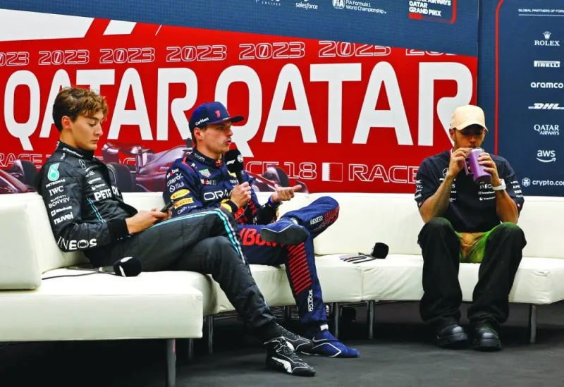 Max Verstappen (centre) during a press conference after securing pole position alongside second placed George Russell and Lewis Hamilton (right) during the Qatar Grand Prix at Lusail International Circuit on Friday. (Reuters)