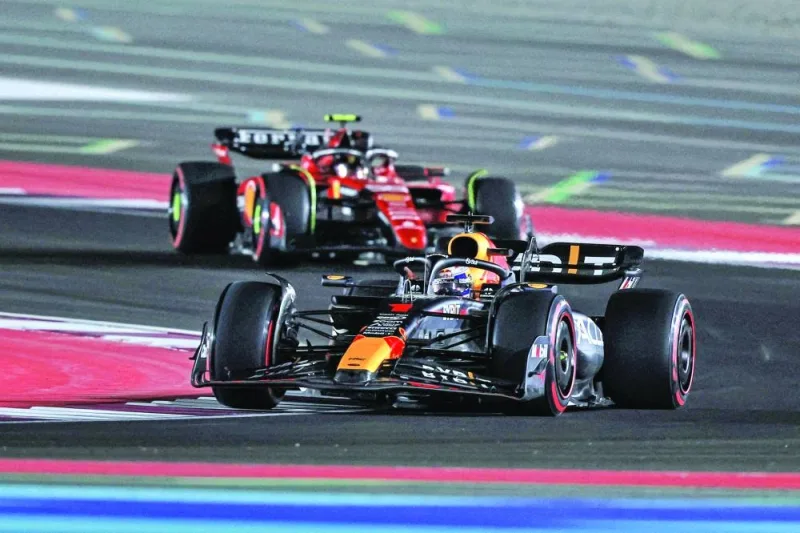 Max Verstappen (foreground) drives ahead of Ferrari’s Spanish driver Carlos Sainz during the qualifying session ahead of the Qatar Formula One Grand Prix at Lusail International Circuit on Friday. (AFP)