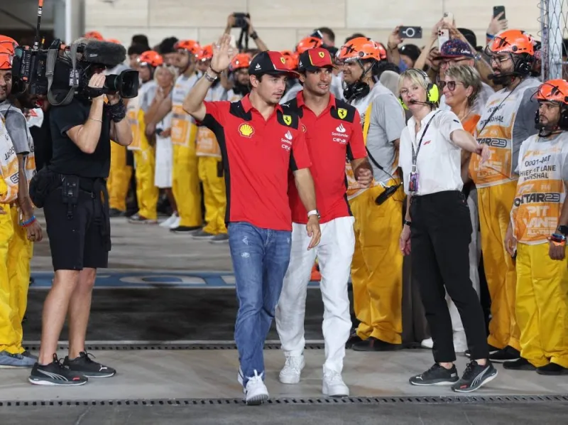 Ferrari&#039;s Charles Leclerc and Carlos Sainz Jr. before the race. REUTERS/Ibraheem Al Omari