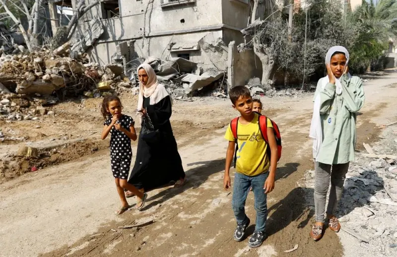 People flee their homes amid Israeli strikes in the southern Gaza Strip Sunday. REUTERS/Ibraheem Abu Mustafa