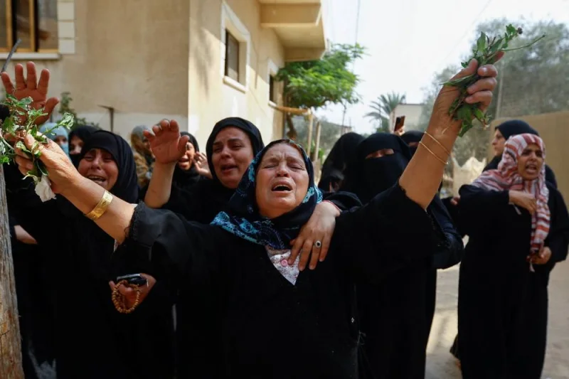 Mourners react during the funeral of Palestinian twin babies Ossayd and Mohammad Abu Hmaid, their mother and their three sisters, who health officials said were killed in Israeli strikes, during their funeral in Khan Younis in the southern Gaza Sunday. REUTERS/Ibraheem Abu Mustafa