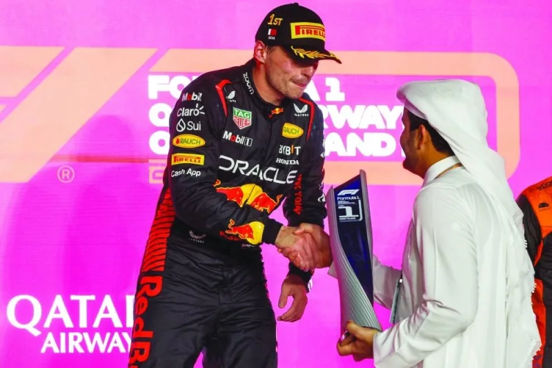 Qatar Olympic Committee President HE Sheikh Joaan bin Hamad al-Thani presents the winner’s trophy to Max Verstappen of Red Bull after his win in Formula 1 Qatar Airways Qatar Grand Prix 2023 at Lusail International Circuit Sunday. Reuters