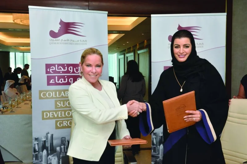 QBWA vice-chairwoman Aisha Alfardan and Greater Washington Hispanic Chamber of Commerce president Nicole Quiroga shaking hands after signing the MoU.