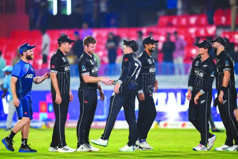 New Zealand’s Mitchell Santner (fourth right) shakes hands with his teammates at the end of the 2023 ICC Cricket World Cup match against Netherlands in Hyderabad on Monday. (AFP)
