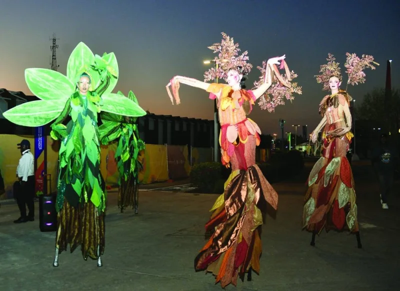 Performers on stilts at Expo 2023 Doha Tuesday.