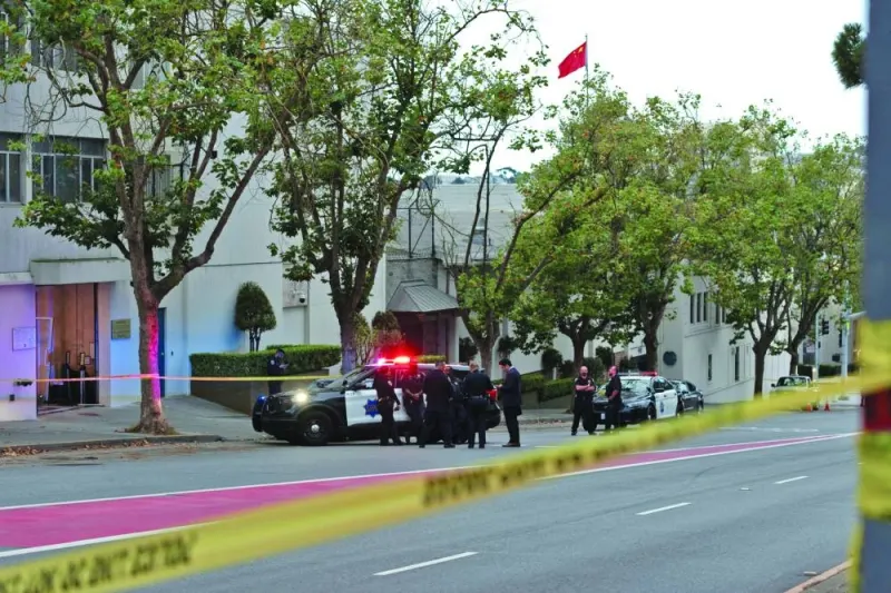 
Officers are seen outside the visa office of the Chinese consulate in San Francisco, where a vehicle crashed into the building earlier. 