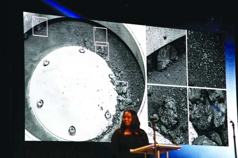 
A picture of some of the sample matter collected from the asteroid is displayed during a press conference for the OSIRIS-REx sample unveiling at the Johnson Space Center in Houston, Texas, yesterday. 