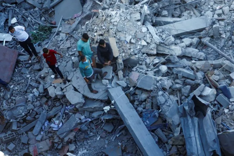 Palestinians search for casualties under the rubble in the aftermath of Israeli strikes amid the ongoing conflict between Israel and the Palestinian Islamist group Hamas, in Khan Younis in the southern Gaza Strip Friday. REUTERS