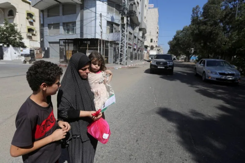 Palestinians flee their houses heading toward the southern part of Gaza Strip after Israel&#039;s call for more than 1 million civilians in northern Gaza to move south within 24 hours, amid the Israeli-Palestinian conflict in Gaza City Friday. REUTERS