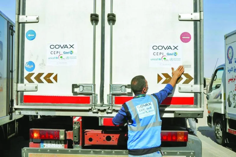
(File photo) A man checks a vehicle containing a shipment of the AstraZeneca vaccine against the Covid-19 at Baghdad International Airport, in Baghdad, Iraq. (Reuters) 