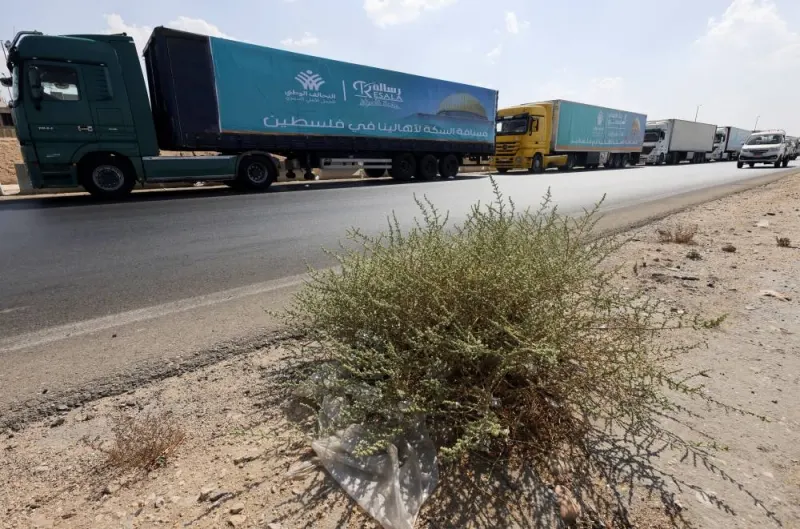 Trucks carrying humanitarian aid to Palestine wait on the desert road (Cairo - Ismailia) on their way to the Rafah border crossing to enter Gaza, amid the ongoing conflict between Israel and the Palestinian Islamist group Hamas, in Cairo, Egypt, Saturday. REUTERS