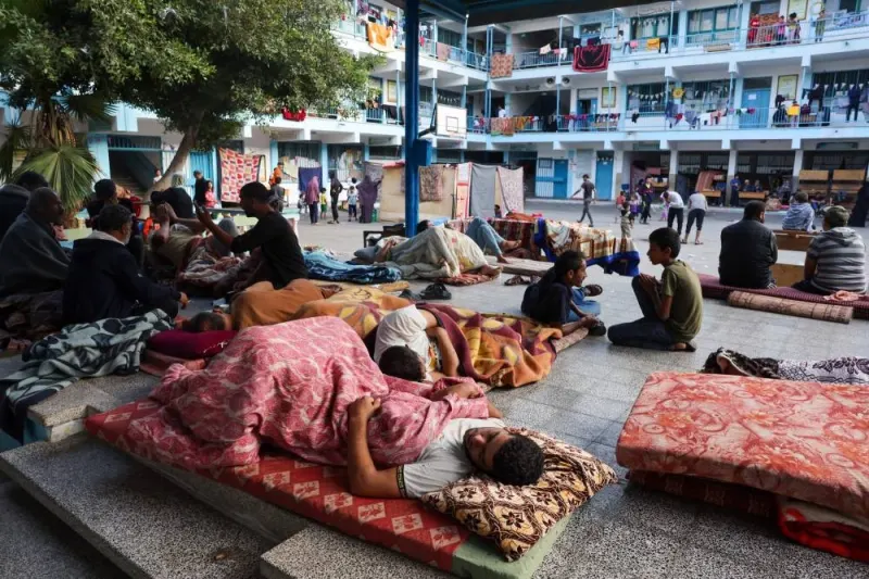 Internally displaced Palestinians rest as they take refuge in a United Nations school, in the Rafah refugee camp, in the southern of Gaza Strip on Saturday. AFP