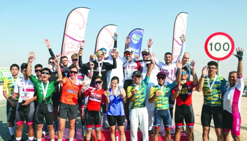 
Participants pose after the completion of the Al Thakira Individual Time Trial. 