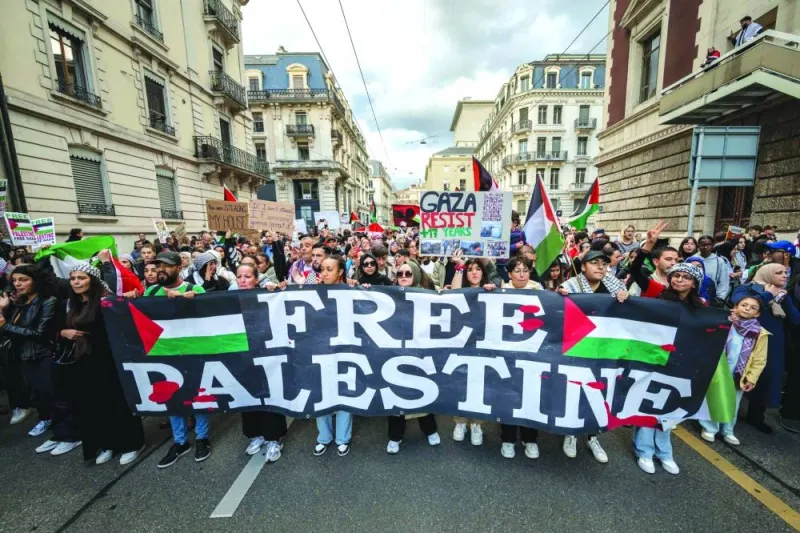 
Protesters hold a banner reading “Free Palestine” during a rally in support of Palestinians in Geneva, Switzerland, yesterday. 