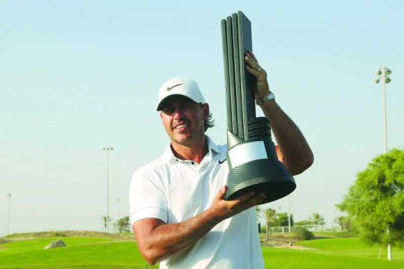 Brooks Koepka of the US celebrates with trophy after winning the 2023 LIV Golf Jeddah champion at Royal Greens Golf in Jeddah yesterday. (AFP)