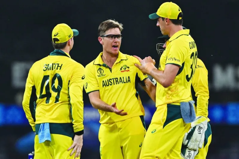 Australia’s Adam Zampa (centre) celebrates with teammates after taking the wicket of Sri Lanka’s Chamika Karunaratne during the 2023 ICC Men’s Cricket World Cup match in Lucknow on Monday. (AFP)