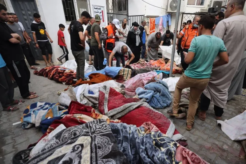 Palestinians victims covered in blankets are laid out on the ground at a hospital following an Israeli airstrike on Rafah, in the southern Gaza Strip Tuesday. AFP