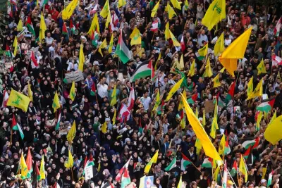 Hezbollah supporters carry flags during a protest, after hundreds of Palestinians were killed in a blast at Al-Ahli hospital in Gaza that Israeli and Palestinian officials blamed on each other, in Beirut&#039;s southern suburbs, Lebanon Wednesday. REUTERS
