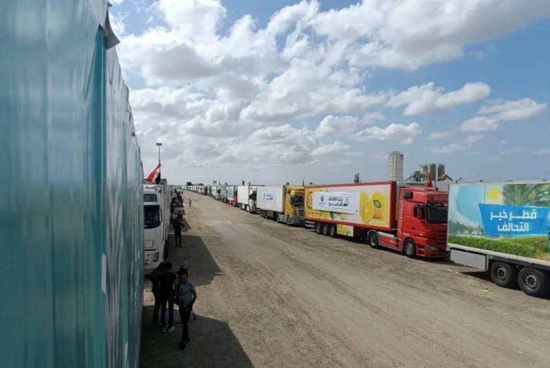 Trucks carrying humanitarian aid from Egyptian NGOs for Palestinians wait for the reopening of the Rafah crossing at the Egyptian side, to enter Gaza, amid the ongoing conflict between Israel and the Palestinian Islamist group Hamas, in Rafah, Egypt Wednesday. REUTERS