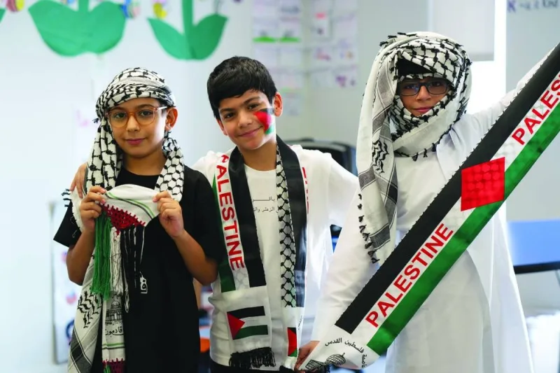 PAGE ONE PIC - Students from a QF school express solidarity with Palestine.