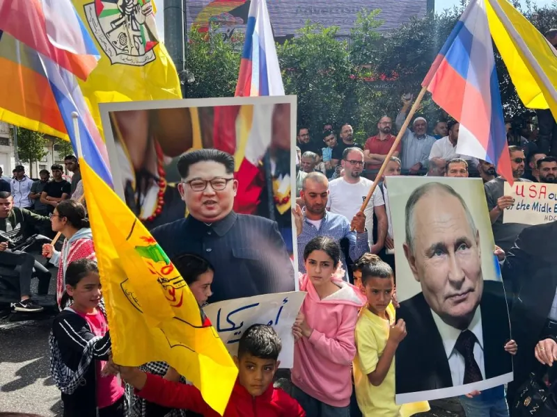 Palestinians hold pictures of the Russian President Vladimir Putin and North Korean leader Kim Jong-UN during a protest in support of the people of Gaza, as the conflict between Israel and Hamas continues, in Hebron in the Israeli-occupied West Bank, Friday. REUTERS