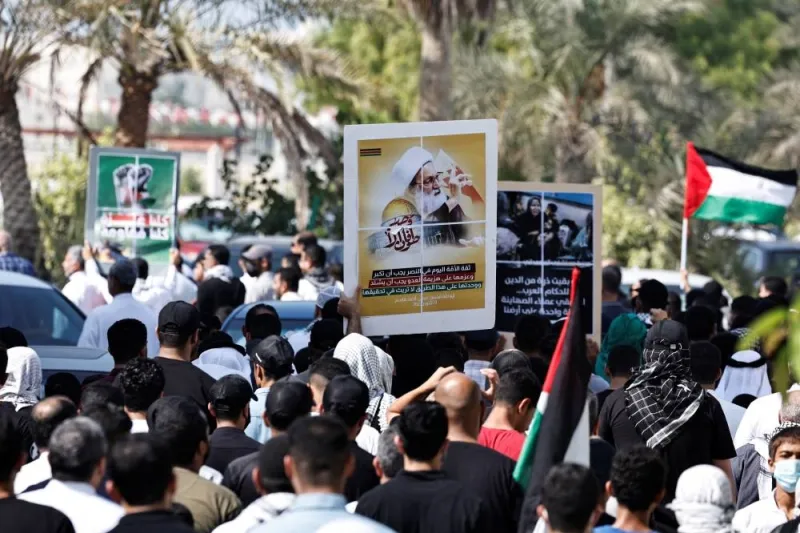 Protesters holding anti-Israel banners and shout anti-Israel slogans as they march during a protest in support of Palestinians after Friday prayers in the village of Diraz, Bahrain, Friday. REUTERS