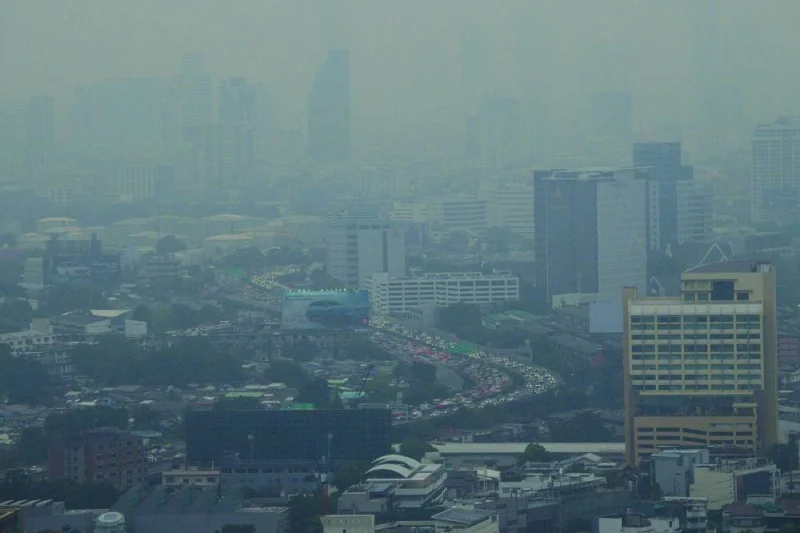 
Vehicles sit in traffic on a busy road amid high levels of air pollution in Bangkok. 