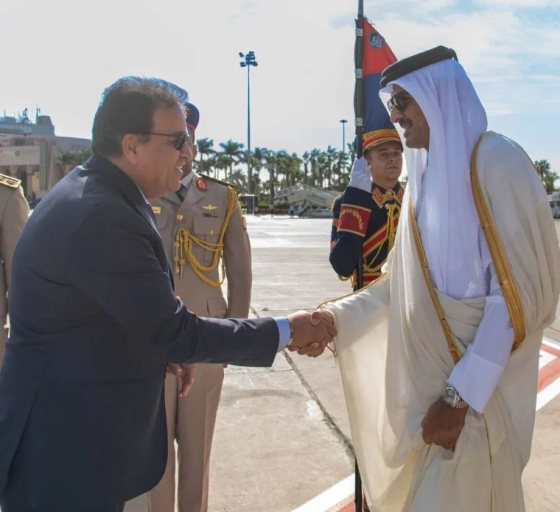 His Highness the Amir Sheikh Tamim bin Hamad Al-Thani being welcomed by the Minister of Health and Population Dr. Khaled Abdel Ghaffar upon arrival at Cairo International Airport.