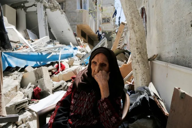 Palestinian woman Intisar Muhana, 97, who was forced to flee al-Masmiyya village during the &#039;Nakba&#039; in 1948 and whose house was destroyed in an Israeli strike in the recent Israel-Gaza fighting, sits in front of the rubble of her house, in Gaza City, on May 14, 2023.