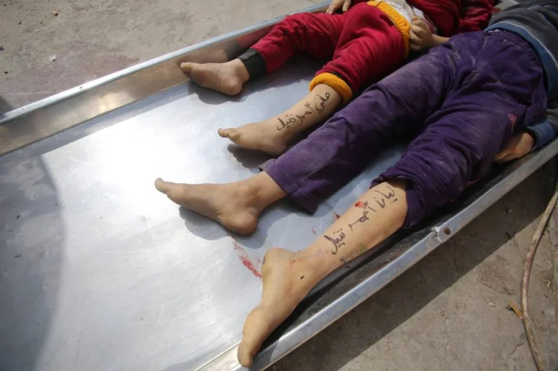 The bodies of children from the Nateel family, with their names Hani (L) and Layan written on their legs by their parents to help in identification, lie in the morgue of a hospital in Deir el-Balah following an Israeli air strike on the central Gaza Strip Sunday. AFP