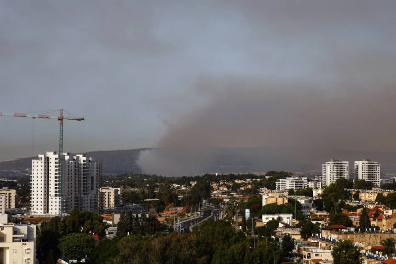 Smoke rises above Israel&#039;s border with Lebanon, as seen from Nahariya in northern Israel, Sunday. REUTERS
