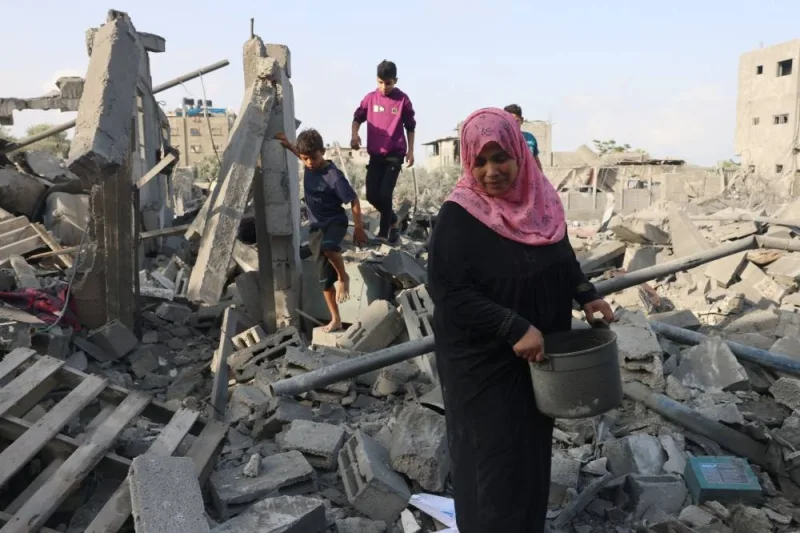  Palestinians inspect the damage after overnight Israeli strikes on Rafah in the southern Gaza Strip on Sunday. AFP