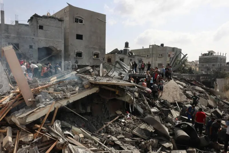 Palestinians inspect the rubble after an Israeli strike on Rafah in the southern Gaza Strip on Sunday. AFP