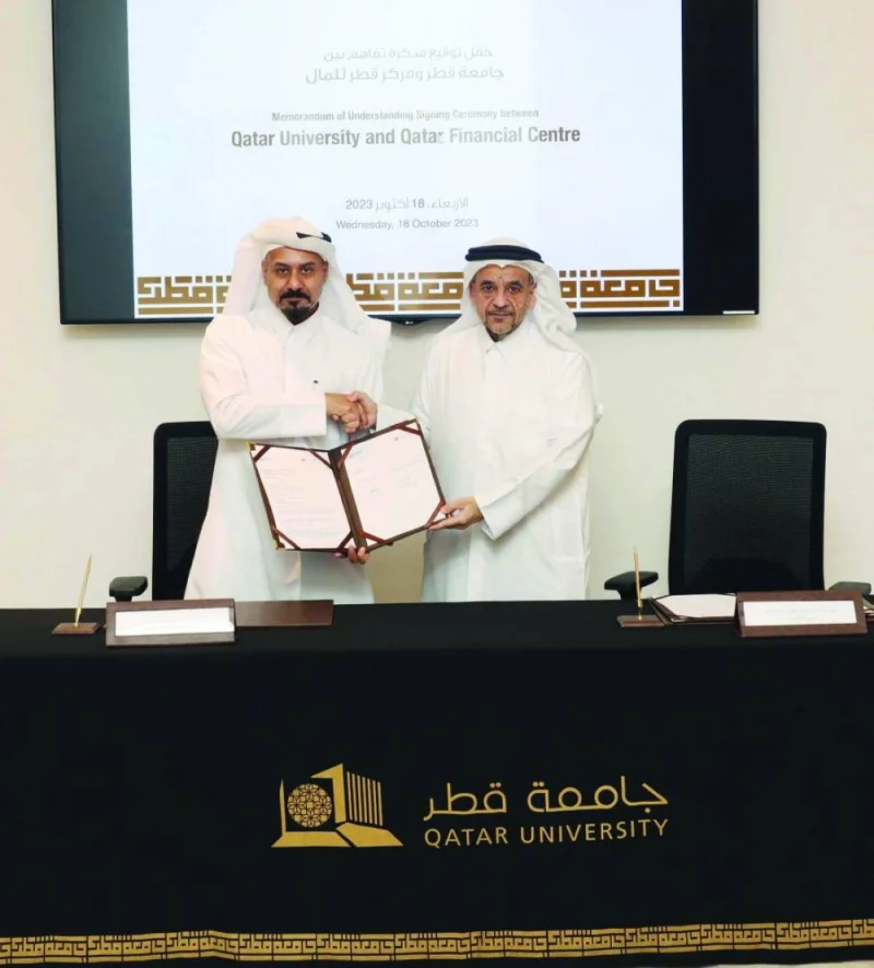 Dr Omar al-Ansari and Yousuf Mohamed al-Jaida sign the MoU setting the stage for a strategic partnership between QU and QFC that “promises to reshape the future of Qatar&#039;s innovation, entrepreneurship, and economic development.”