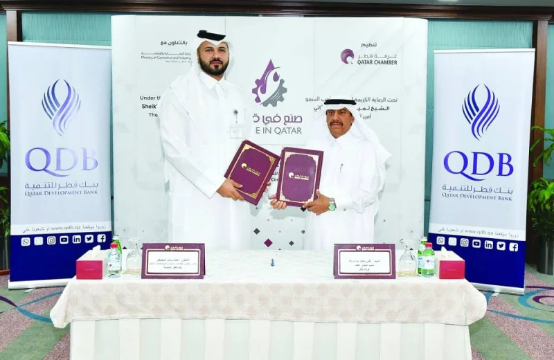 Qatar Chamber deputy general manager Ali bu Sherbak al-Mansouri and QDB executive director of Advisory and Incubation Dr Hamad Salem Mejegheer during the signing ceremony held at the chamber&#039;s Doha headquarters.