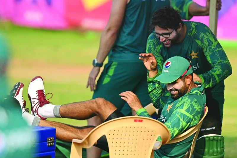 Pakistan’s Imam-ul-Haq speaks with captain Babar Azam (front) during a practice session ahead of their 2023 ICC Men’s Cricket World Cup match against South Africa at the MA Chidambaram Stadium in Chennai. (AFP)