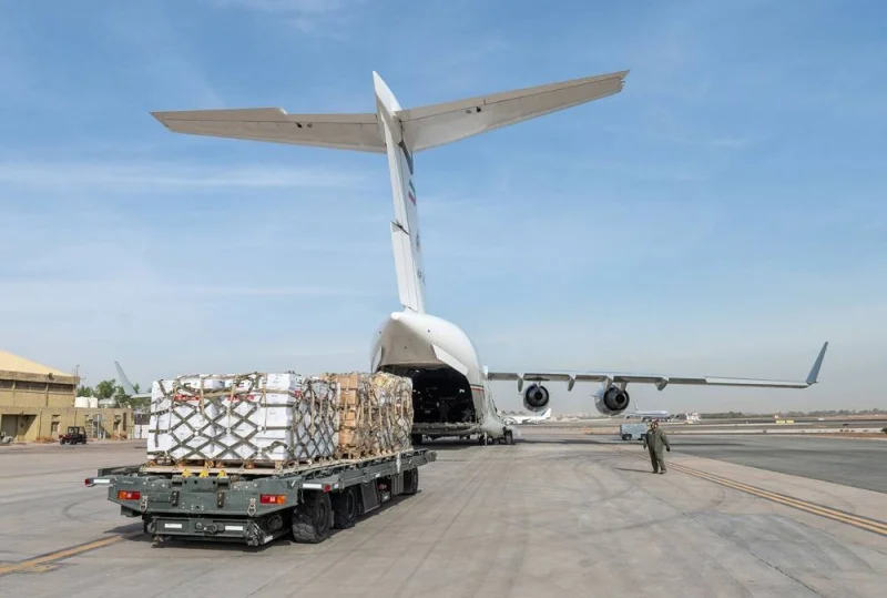 Humanitarian aid bound for the Gaza Strip through Egypt&#039;s northern Rafah border crossing, being loaded into a military aircraft at the International Airport in Kuwait City. AFP/KUNA