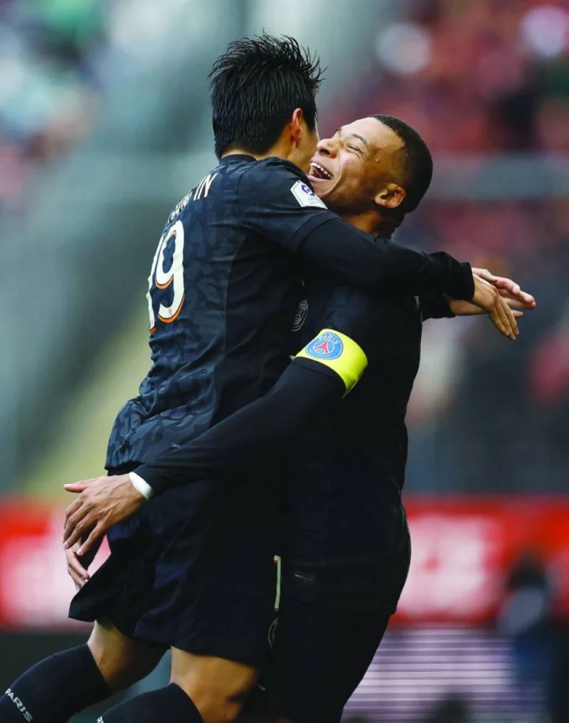
Paris St Germain’s Kylian Mbappe celebrates scoring their second goal against Brest with teammate Lee Kang-in yesterday. (Reuters) 