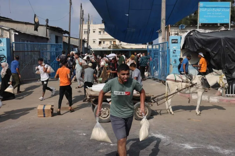 Palestinians storm a UN-run aid supply center, that distributes food to displaced families following Israel&#039;s call for more than one million residents in northern Gaza to move south for their safety, in Deir al-Balah on October 28. REUTERS