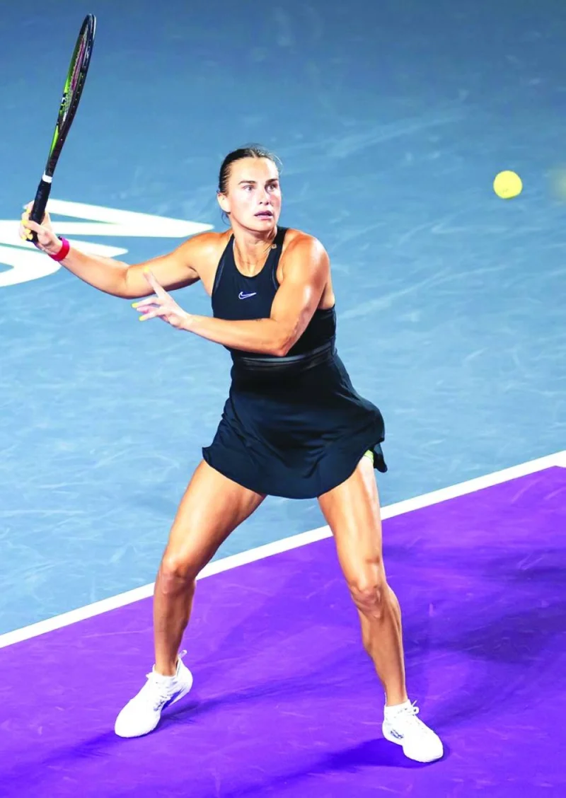 
Aryna Sabalenka hits a forehand during her match against Greece’s Maria Sakkari at the WTA Finals in Cancun, Mexico. 