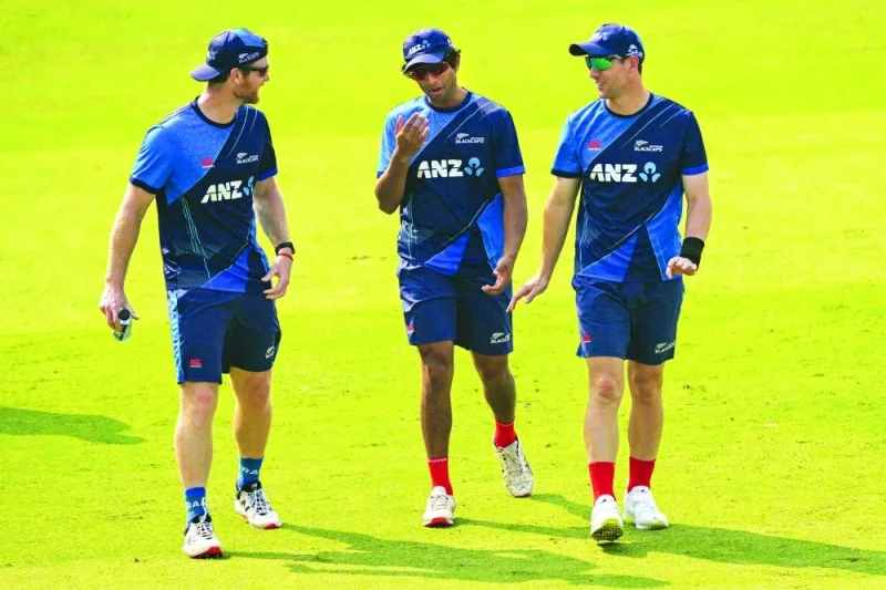 New Zealand’s Glenn Phillips (left), Rachin Ravindra (centre) and Matt Henry chat during a practice session. (AFP)