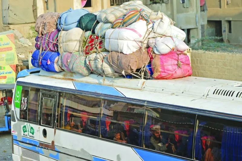 Afghan refugees depart for Afghanistan from the Karachi bus terminal in Sindh province on Tuesday. (AFP)