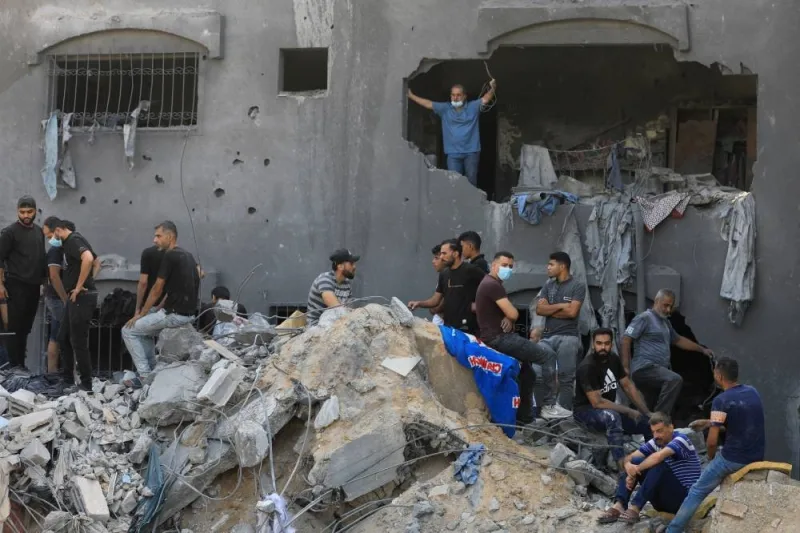 Palestinians search for casualties a day after Israeli strikes on houses in Jabalia refugee camp in the northern Gaza Strip, Wednesday. REUTERS