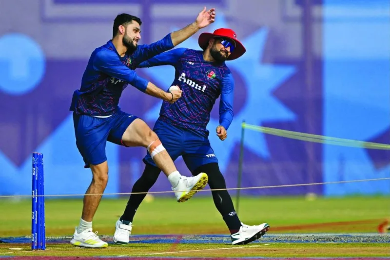 Afghanistan’s Naveen-ul-Haq (left) and Rashid Khan deliver balls during a practice session on Thursday. (AFP)
