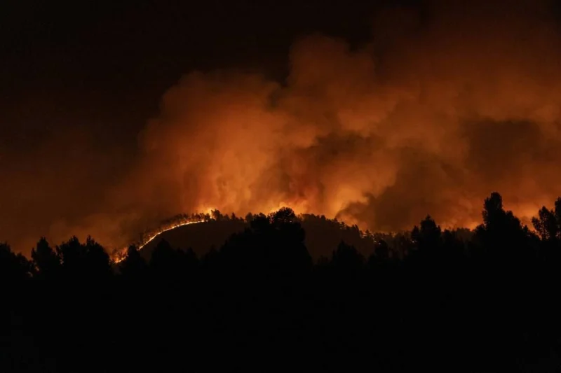 A forest fire burns in the hills near Villanueva de Viver, Spain, in the early hours of Friday March 24, 2023. Hundreds of people were evacuated as a major forest fire raged in Spain's eastern Castellon region on Friday, marking the early start to the nation's fire season amid bone dry conditions. (Lorena Sopena/Europa Press via AP) **SPAIN OUT**