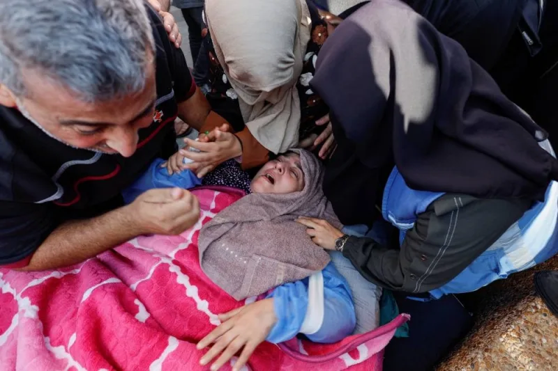 A Palestinian woman from the Abu Hattab family mourns her husband in Khan Younis in the southern Gaza Strip, on Friday. REUTERS