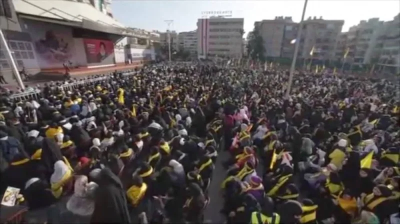 A crowd watches Hezbollah leader Sayyed Hassan Nasrallah deliver his first address since the October conflict between Palestinian group Hamas and Israel, on a screen in Beirut, Lebanon, in this screenshot taken from video obtained Friday. Al-Manar via REUTERS