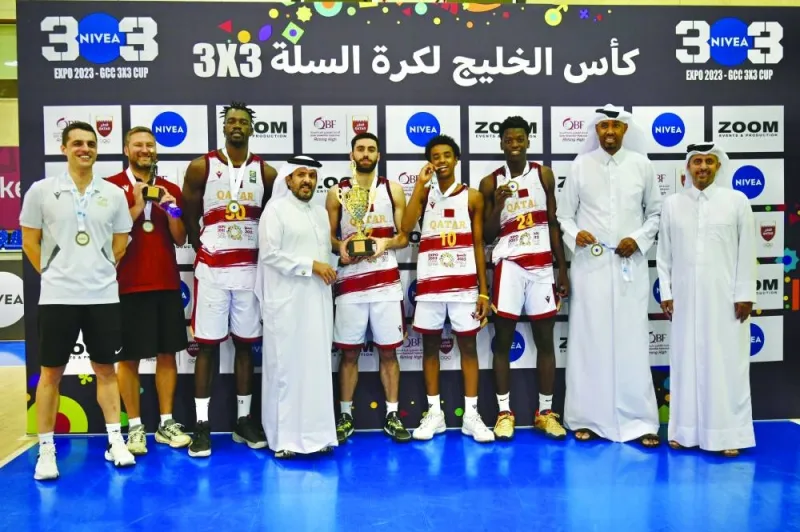 
Qatar’s B team pose with QBF Secretary-General Saadoun Sabah al-Kuwari, QBF’s Board of Directors member Abdul Rahman al-Hitmi and Assistant Treasurer of the Kuwait Basketball Association Meshal Mohamed after winning the GCC 3×3 Basketball Championship at the Al Gharafa Sports Hall. 