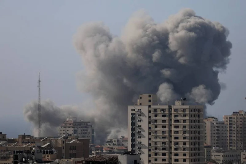 Smoke rises after Israeli strikes in Gaza City Monday. REUTERS