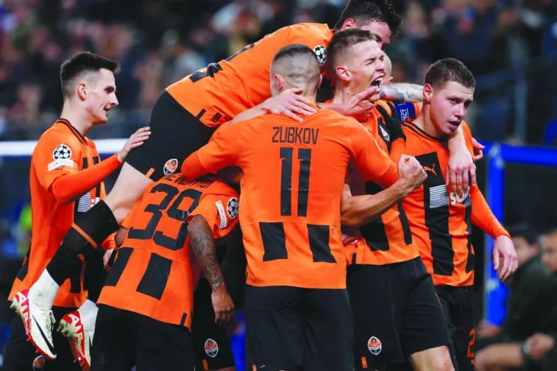 
Shakhtar Donetsk’s Danylo Sikan (second right) celebrates with teammates after scoring against Barcelona during the Champions League Group H match in Hamburg, Germany.  (AFP) 